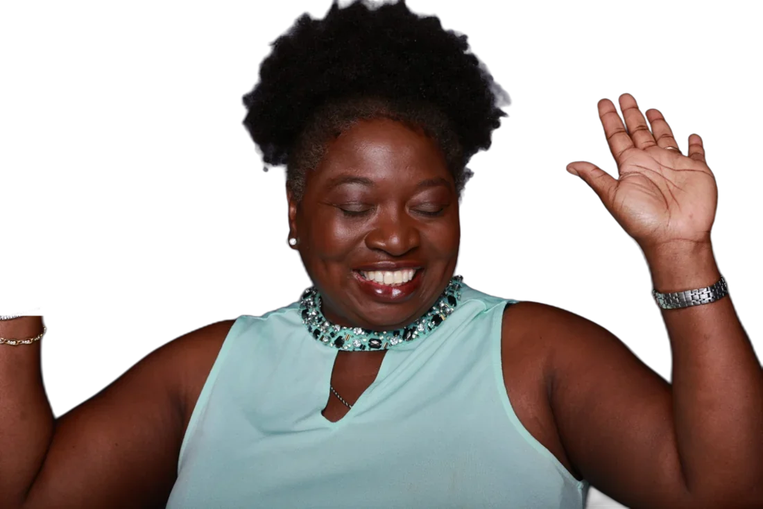 Kelly Jennings laughing with one hand raised